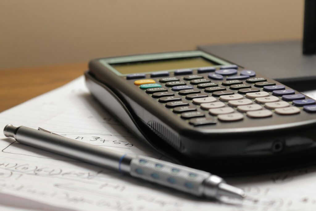 Image of a calculator on a desk.