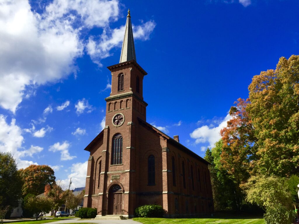 Church in Cold Spring, NY surrounded by fall foliage.
