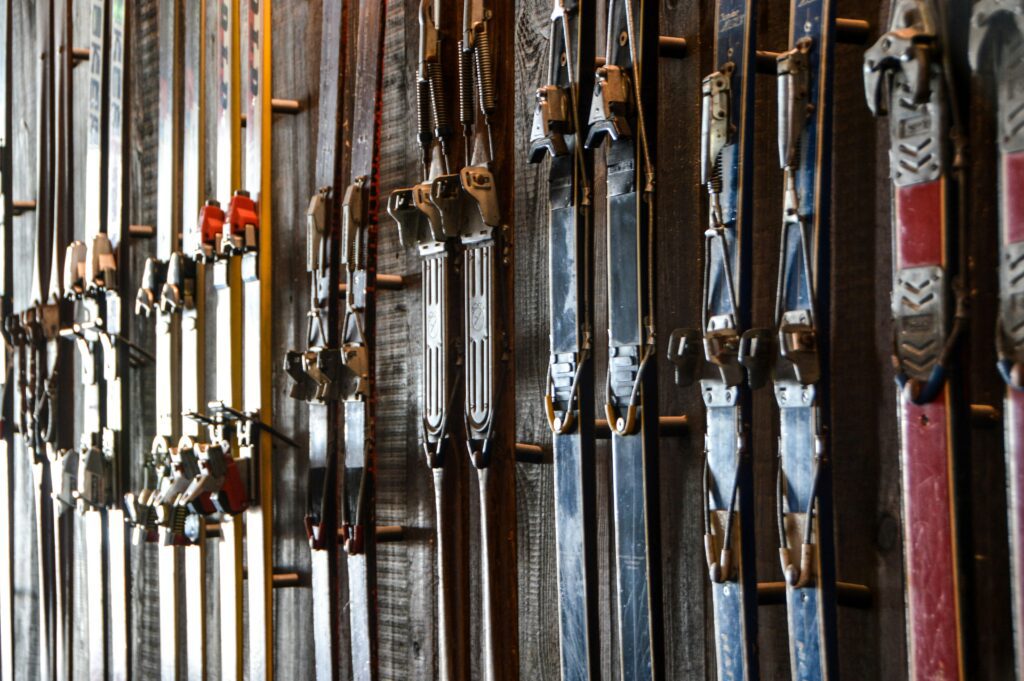A rack of skis in a ski shop.