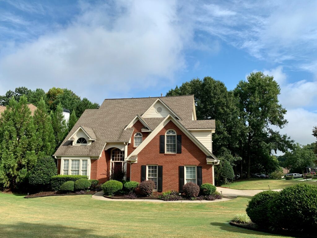 A brick custom colonial home.