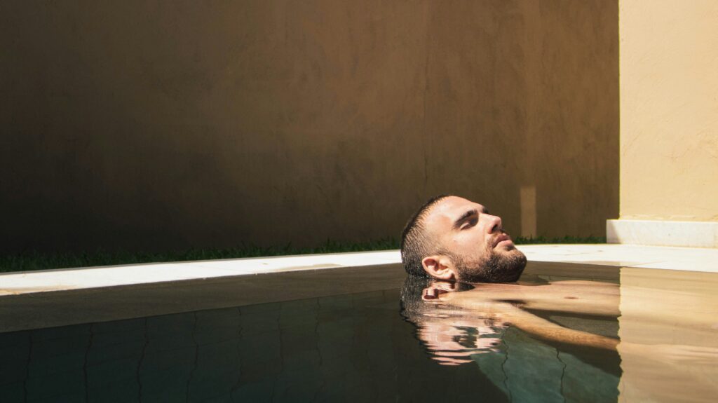 Man at a spa floating in water.
