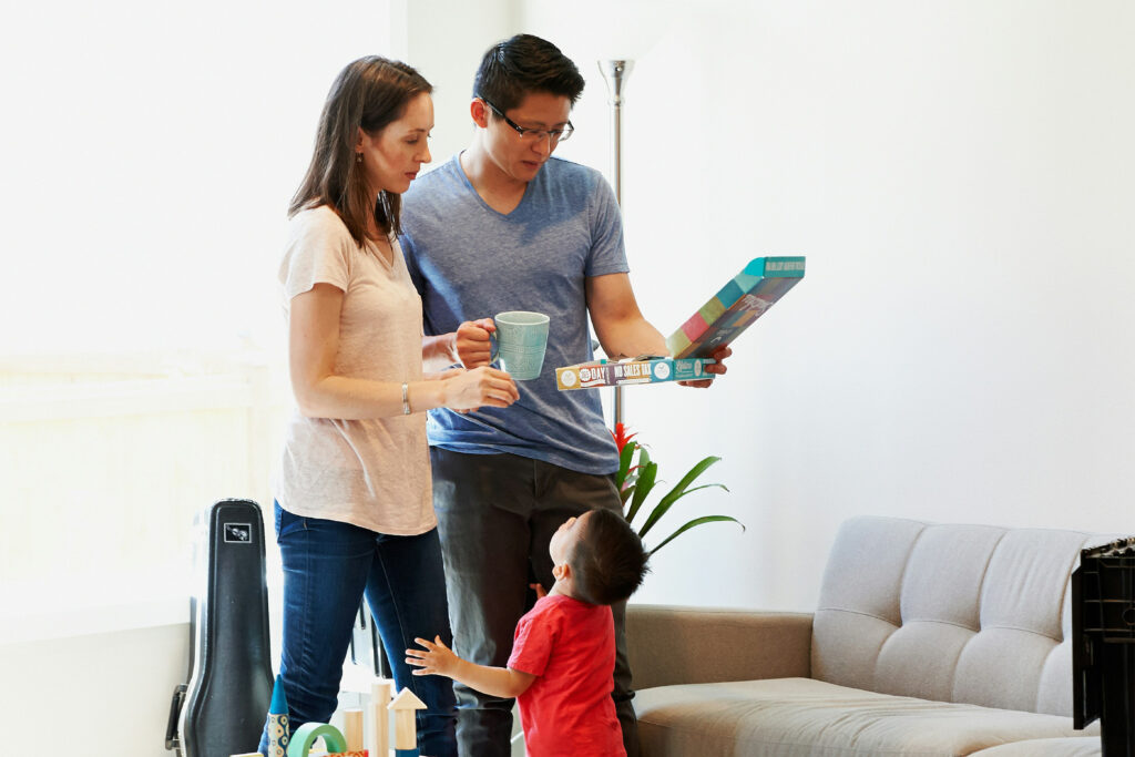 A young family in the living room.