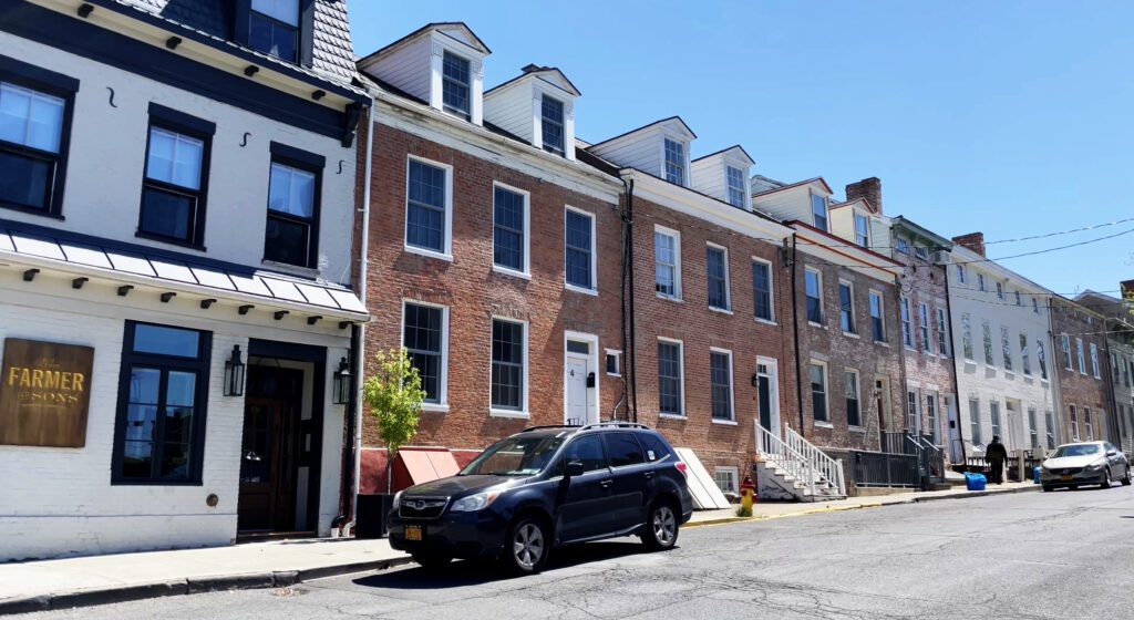 A row of houses along the street in Hudson, NY.