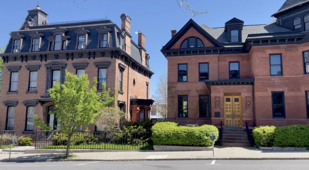 A view of brick houses on a street in Hudson, NY.