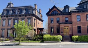 A view of brick houses on a street in Hudson, NY.