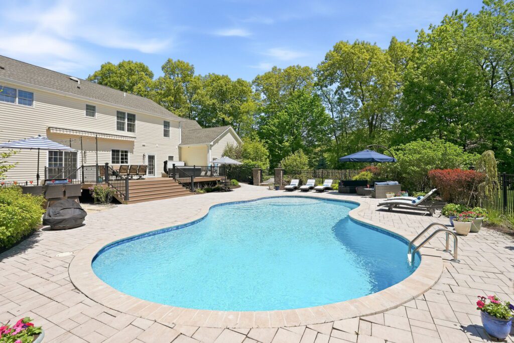 In ground pool and patio at 23 Pheasant Run.
